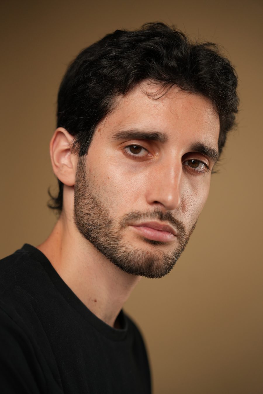 Jovan Penezić, close three-quarter studio portrait.